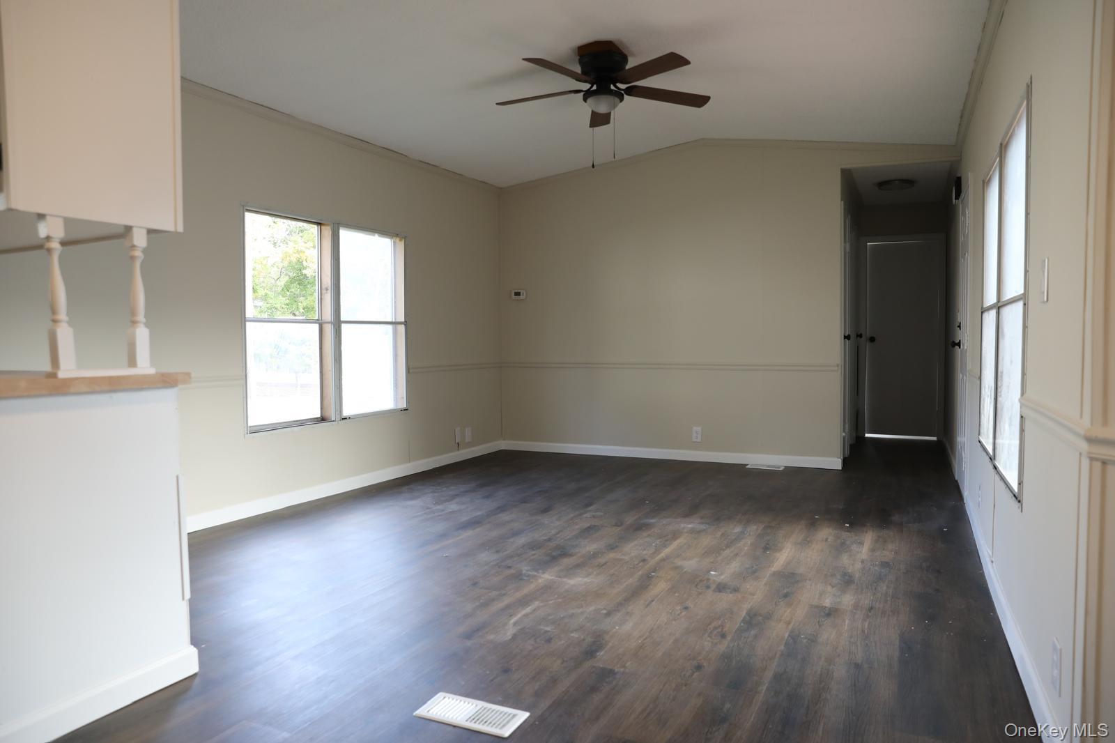 179 Van Wagner Road, Unit LOT 42 Poughkeepsie, NY 12603 - Photo 5 of 19 wooden floor in an empty room with a window