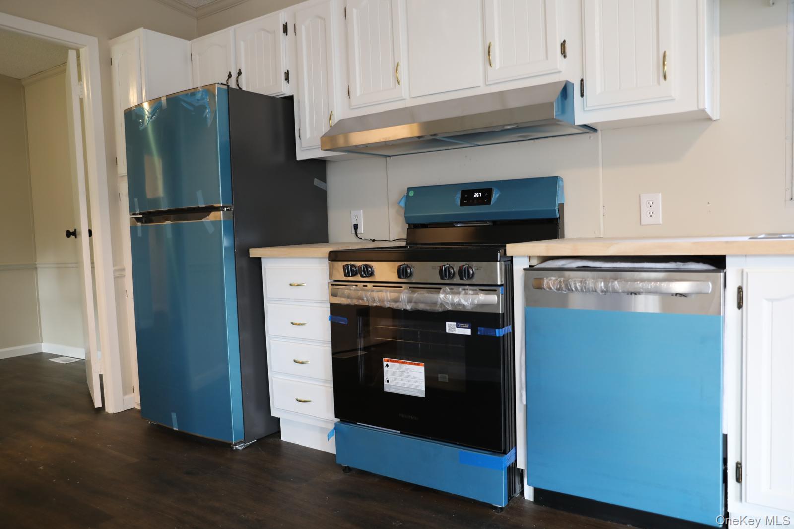 179 Van Wagner Road, Unit LOT 42 Poughkeepsie, NY 12603 - Photo 8 of 19 a kitchen with stainless steel appliances granite countertop a refrigerator and a stove top oven