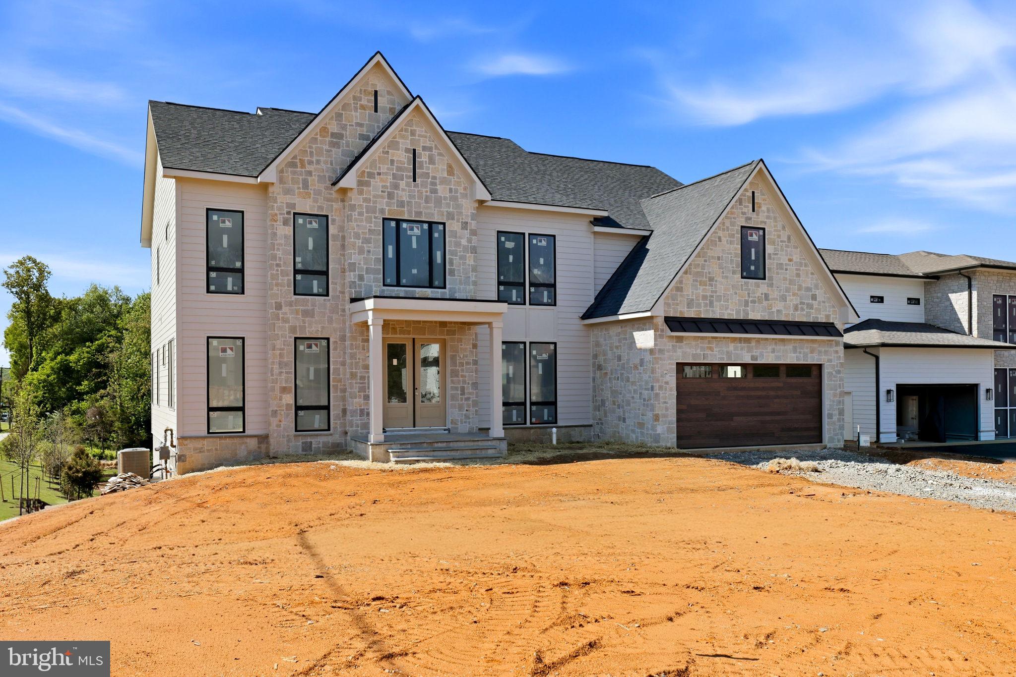 10801 Mason Hunt Court Reston, VA 20190 - Photo 3 of 26 a front view of a house with a yard