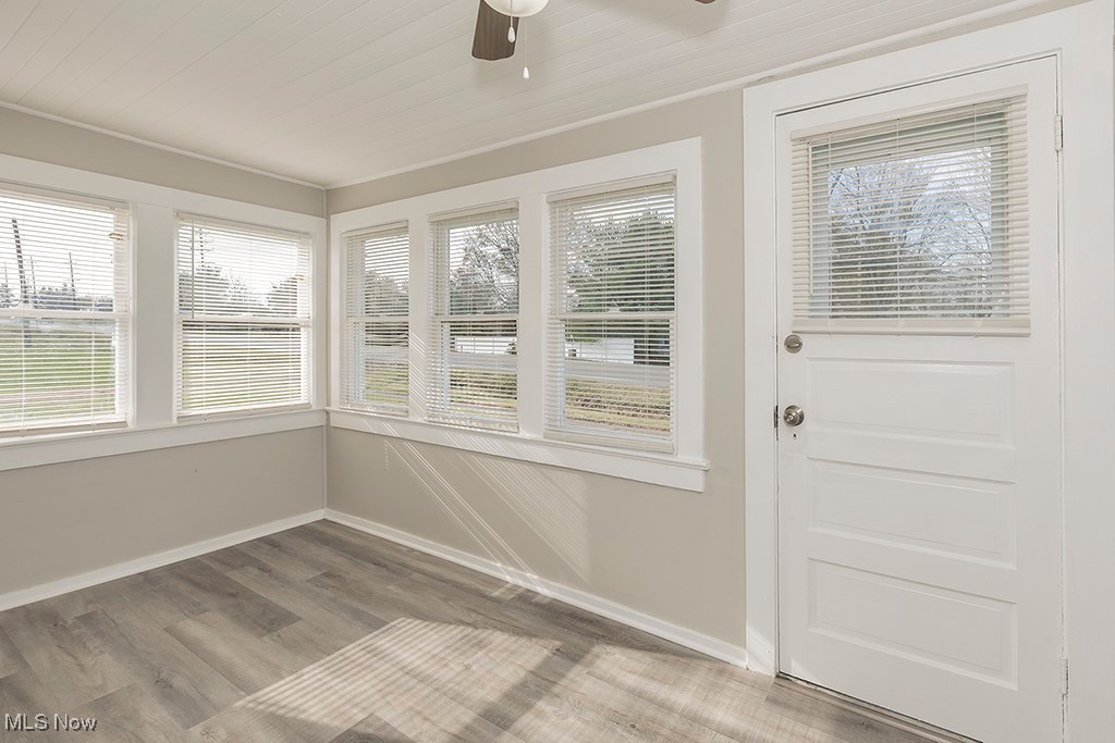 12447 Chillicothe Road Chesterland, OH 44026 - Photo 33 of 42 Unfurnished sunroom featuring ceiling fan and wood ceiling