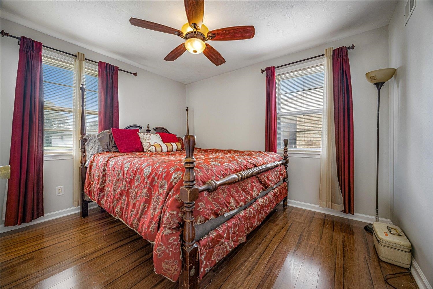 3128 Cherry Road Memphis, TN 38118 - Photo 29 of 40 a bedroom with a bed and a large window with wooden floor