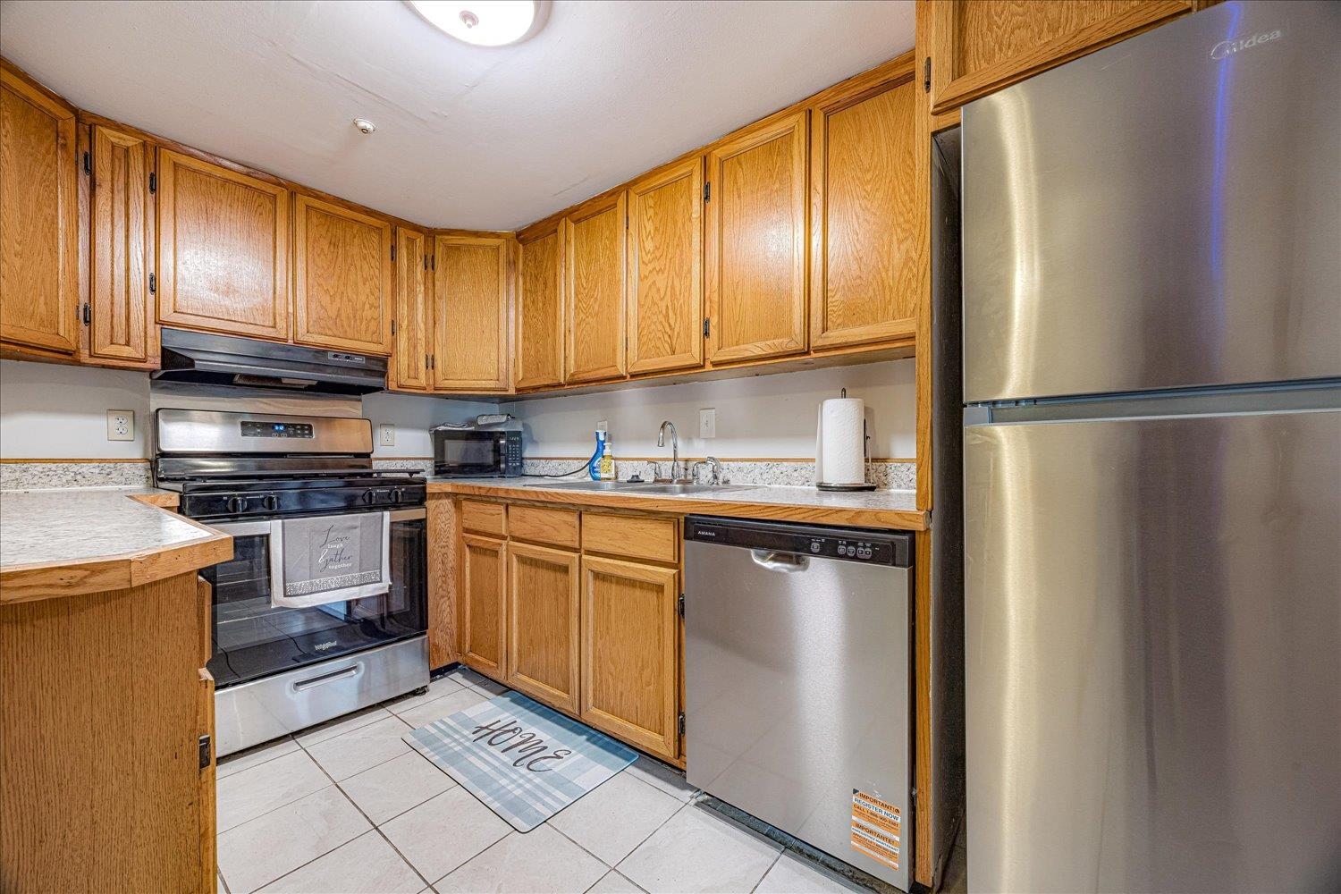 3128 Cherry Road Memphis, TN 38118 - Photo 8 of 40 a kitchen with stainless steel appliances granite countertop a refrigerator sink and cabinets