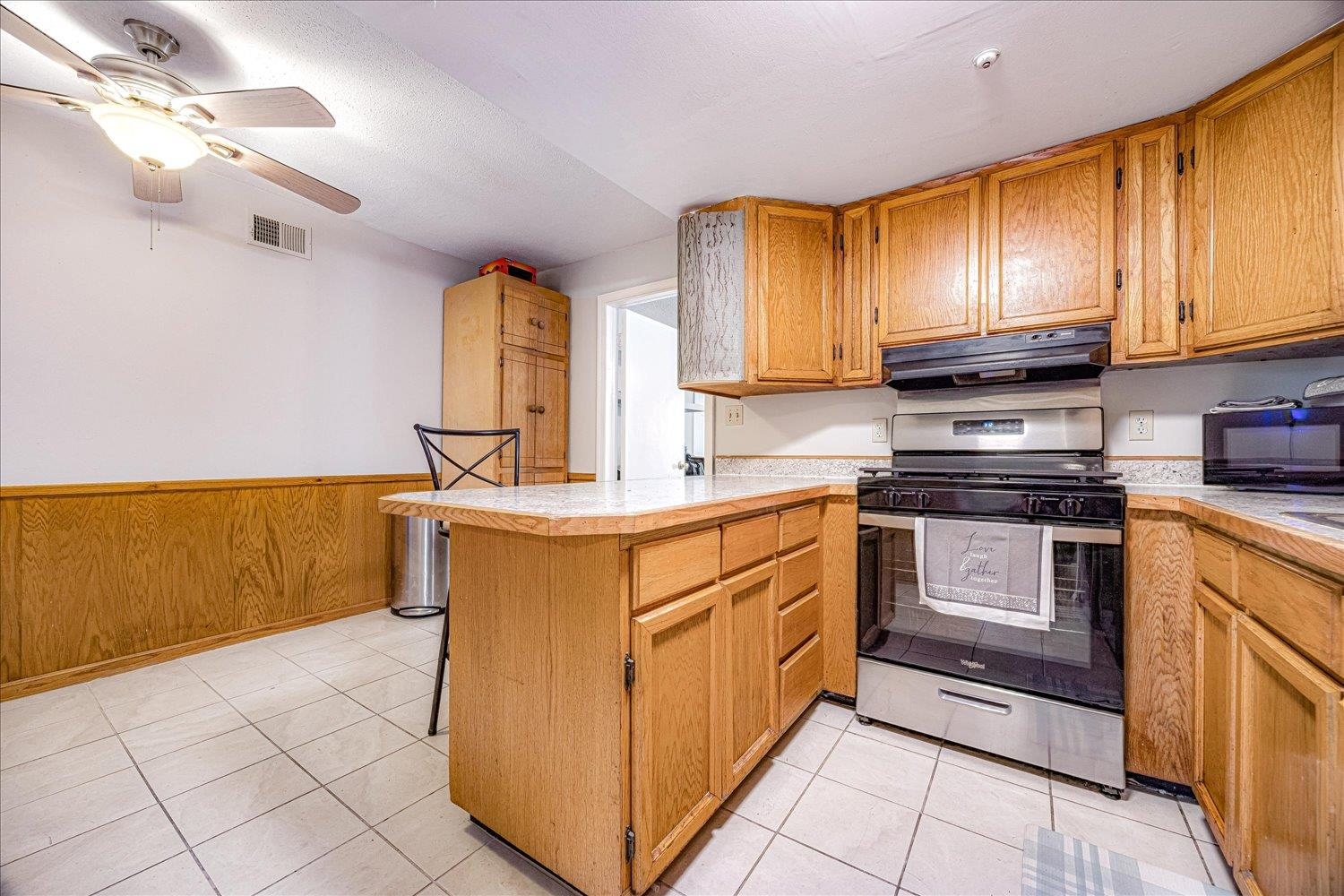 3128 Cherry Road Memphis, TN 38118 - Photo 9 of 40 a kitchen with stainless steel appliances granite countertop a stove a sink and a microwave