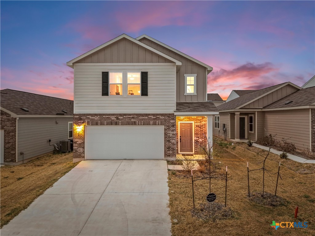 a front view of a house with yard