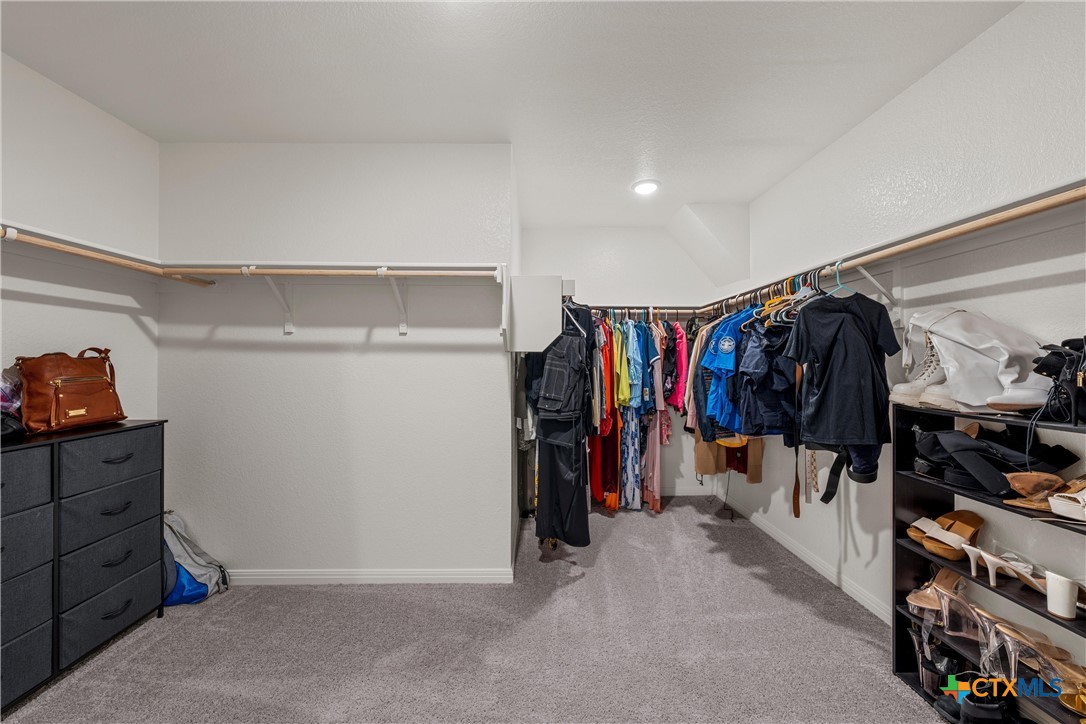 121 Sudden Impact Drive Jarrell, TX 76537 - Photo 16 of 38 a view of walk in closet with clothes and shoes