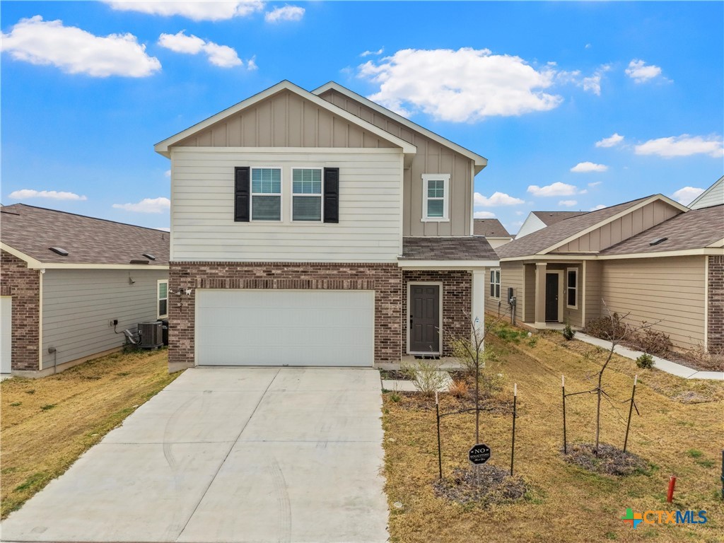 121 Sudden Impact Drive Jarrell, TX 76537 - Photo 2 of 38 a front view of a house with yard