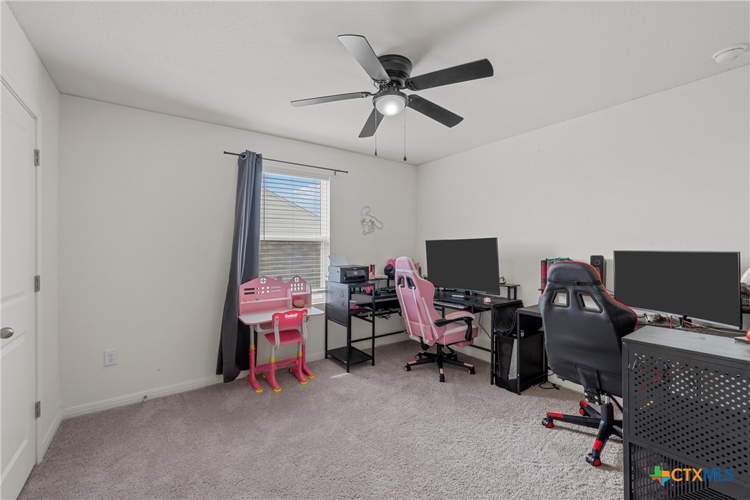 121 Sudden Impact Drive Jarrell, TX 76537 - Photo 24 of 38 a view of a workspace with furniture and a window