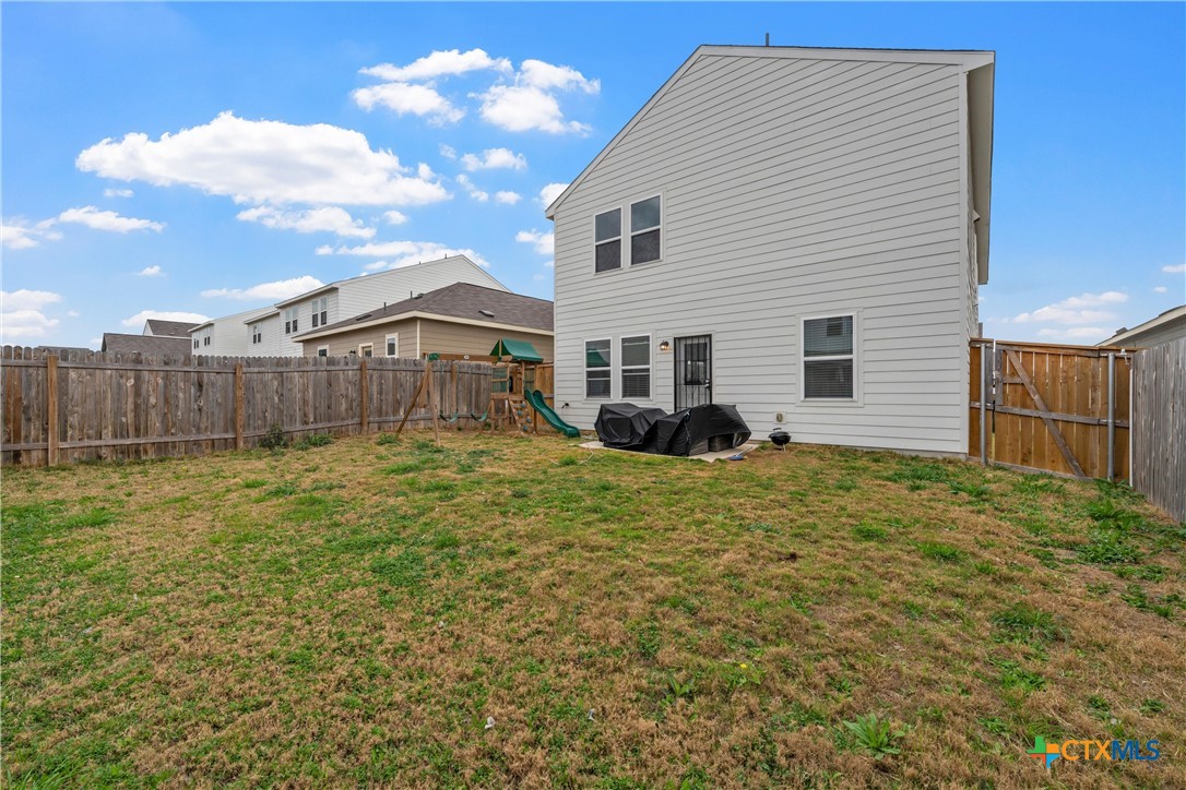 121 Sudden Impact Drive Jarrell, TX 76537 - Photo 27 of 38 a front view of a house with a garden