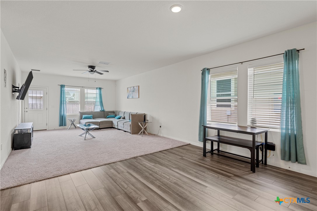 121 Sudden Impact Drive Jarrell, TX 76537 - Photo 5 of 38 a living room with furniture and wooden floor
