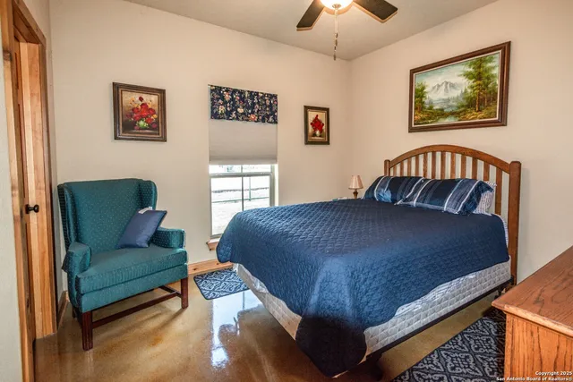 a bathroom with a granite countertop sink a mirror and a bathtub