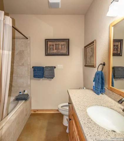 a bed room with a bed and a chair