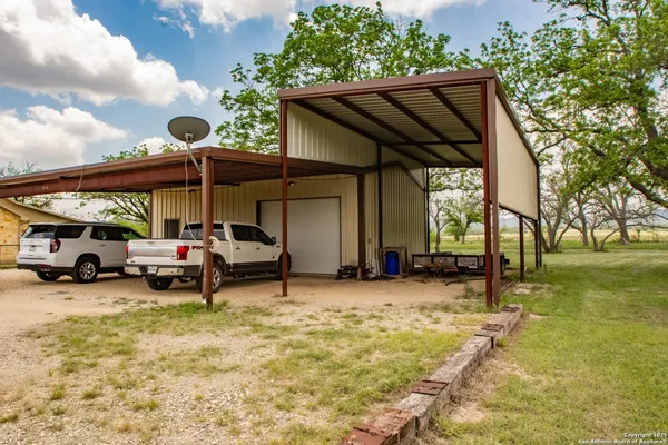 a view of a car park in front of house