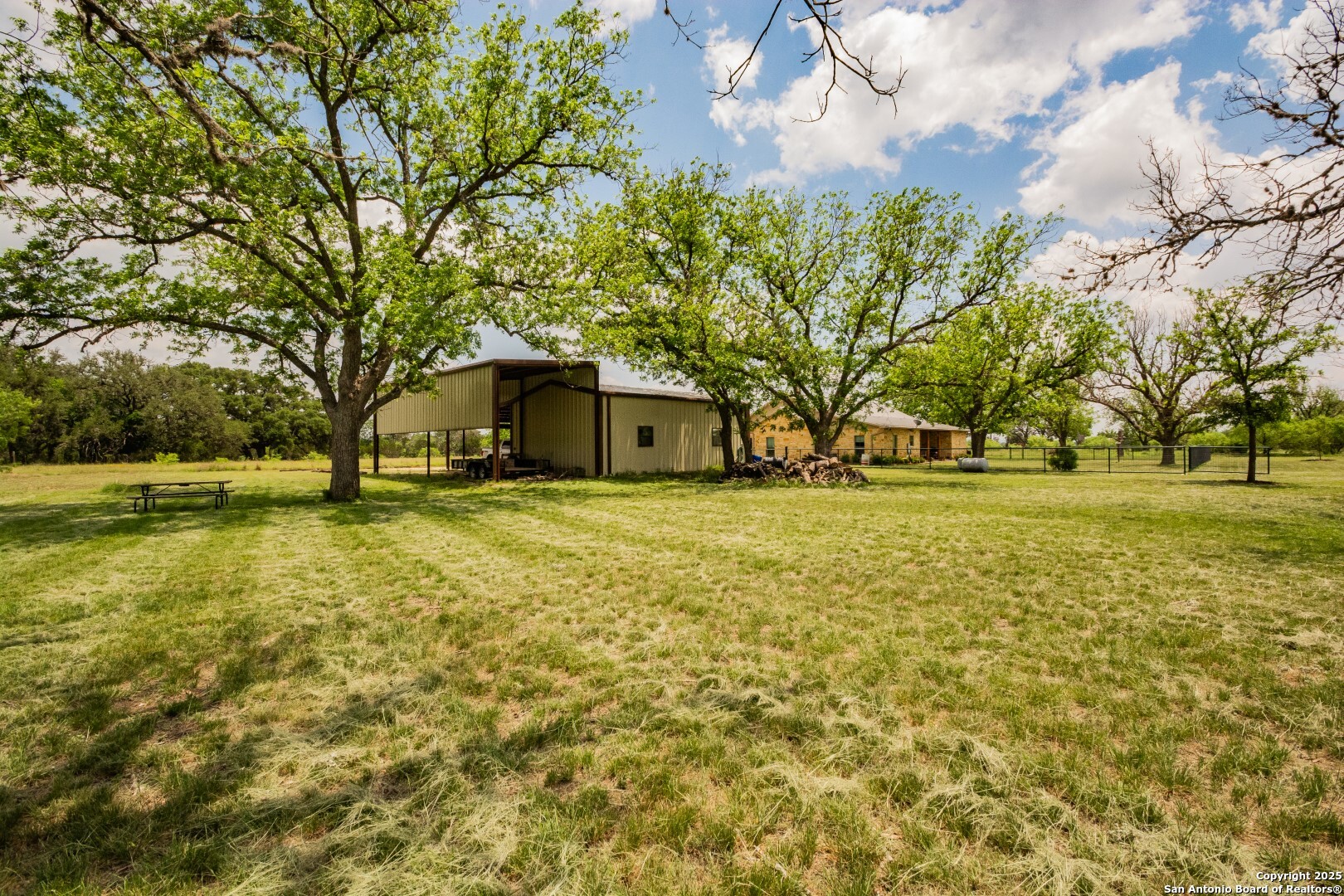 2657 West Sabinal Road Utopia, TX 78884 - Photo 23 of 30 a front view of house with yard and trees