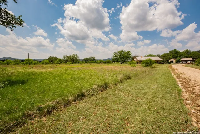 a view of a lake with a yard