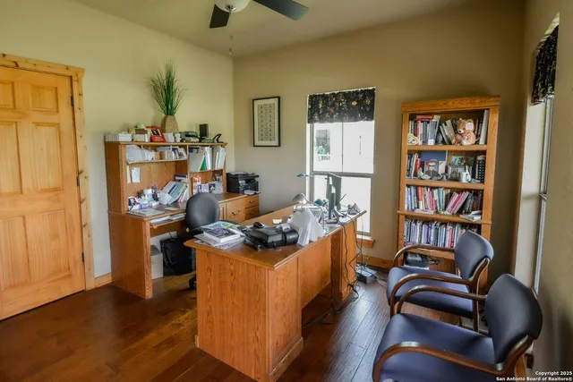 a bathroom with a sink a toilet a mirror and shower