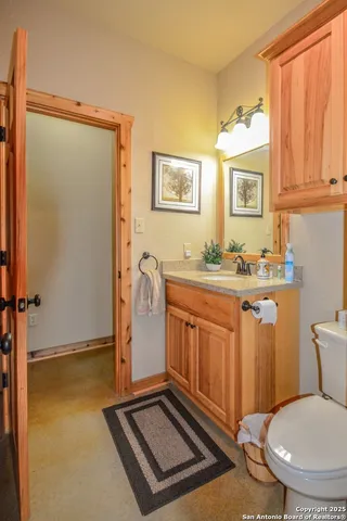 a kitchen with a window a sink and cabinets
