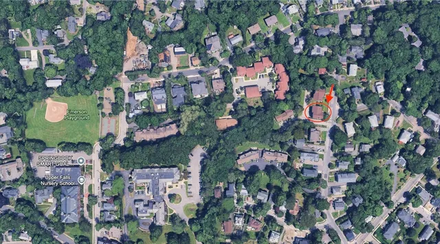 an aerial view of residential houses with outdoor space