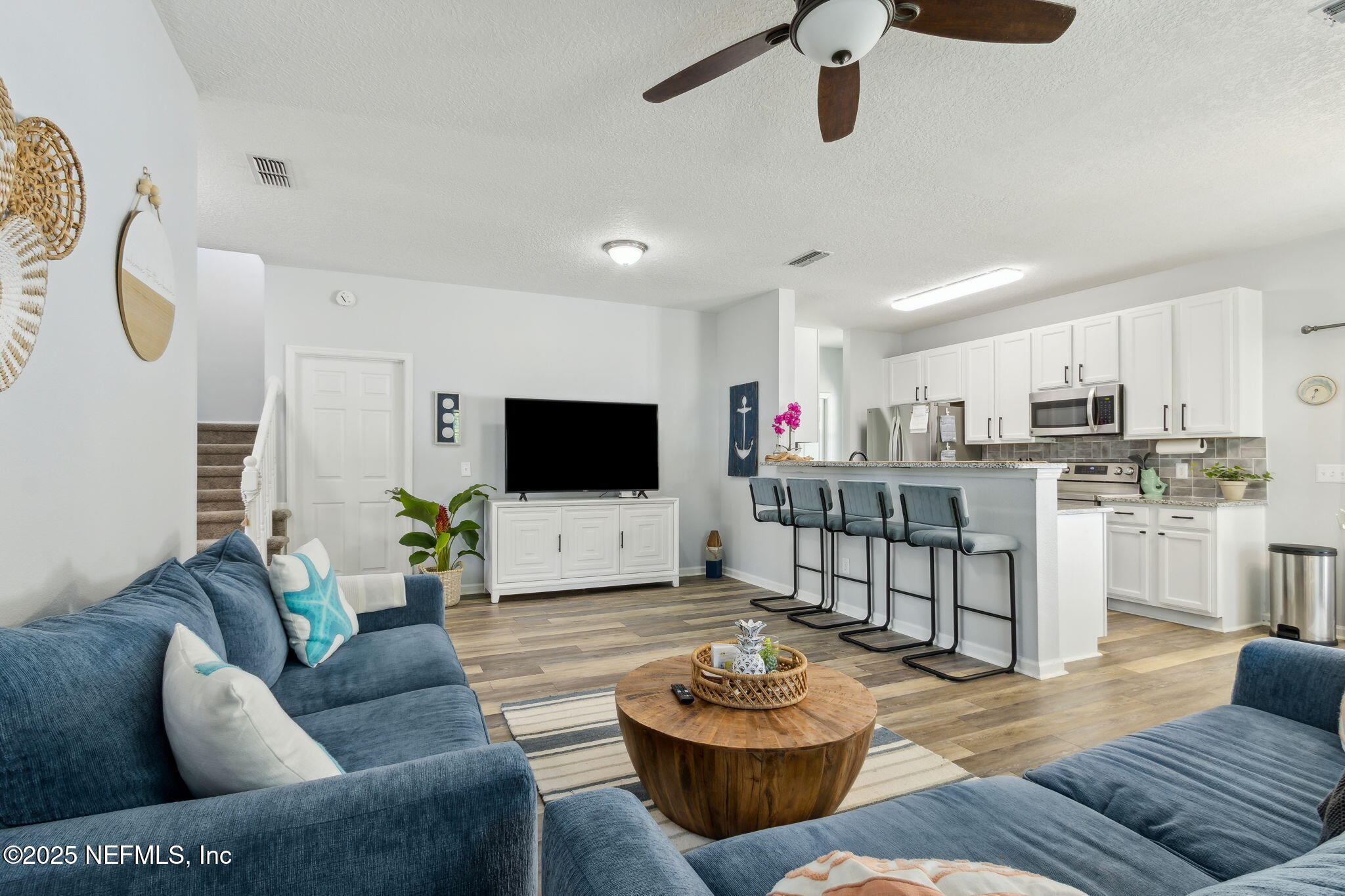 95152 Cypress Trail Fernandina Beach, FL 32034 - Photo 11 of 29 a living room with furniture and a flat screen tv