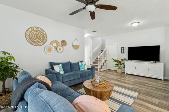 a living room with furniture and a rug