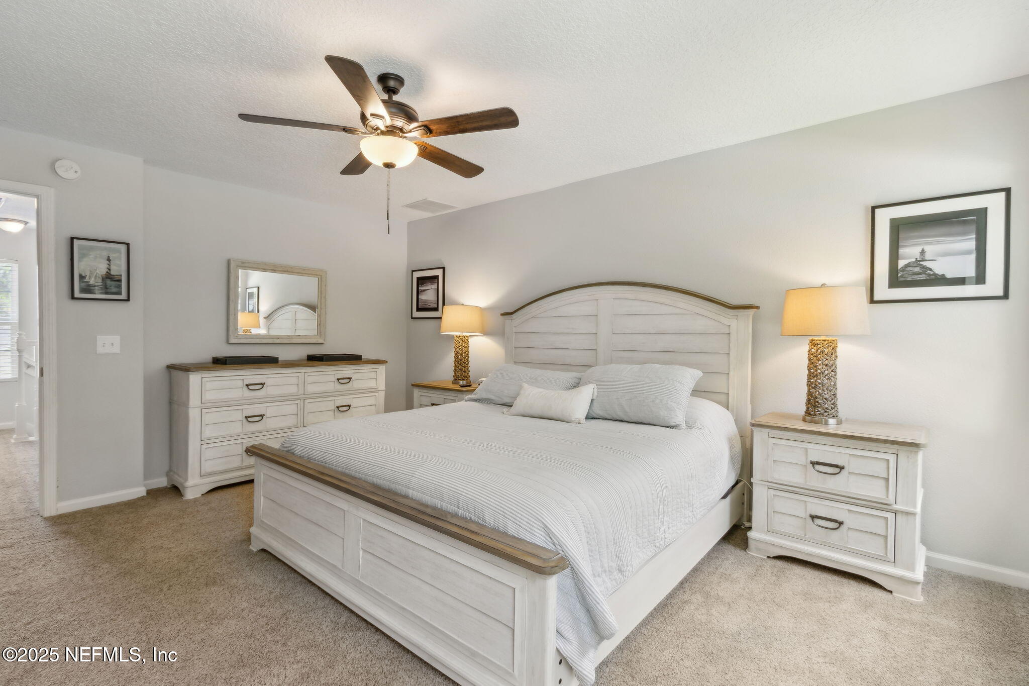 95152 Cypress Trail Fernandina Beach, FL 32034 - Photo 20 of 29 a bedroom with a bed and ceiling fan