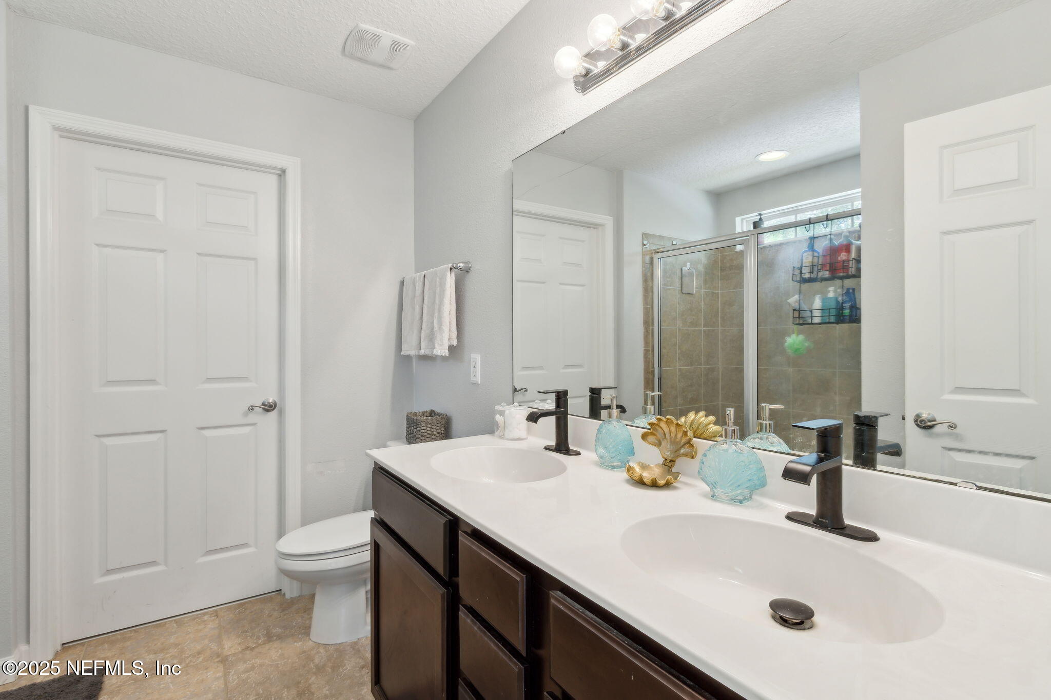 95152 Cypress Trail Fernandina Beach, FL 32034 - Photo 21 of 29 a bathroom with a sink and a mirror