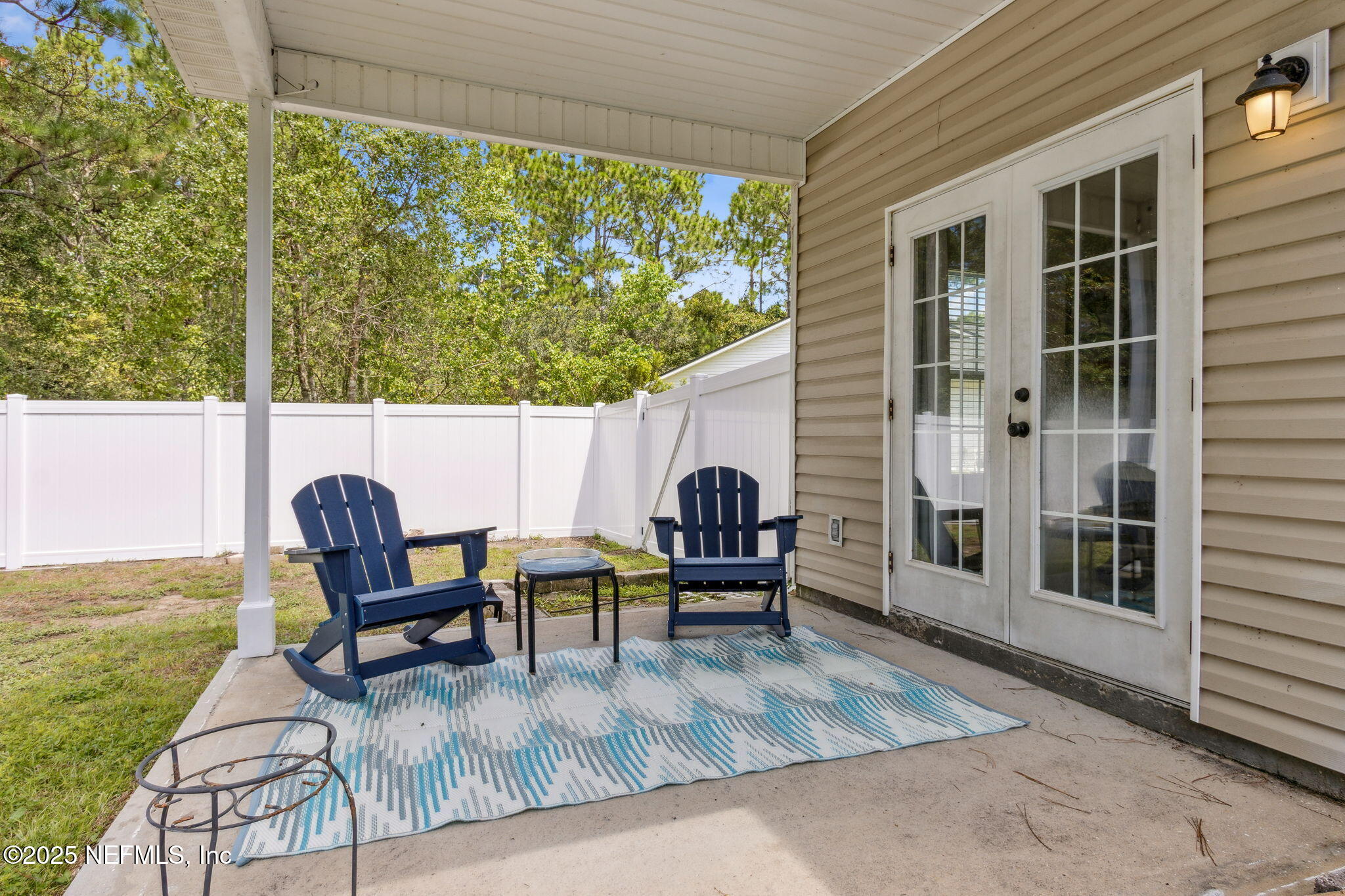 95152 Cypress Trail Fernandina Beach, FL 32034 - Photo 22 of 29 a view of a outdoor sitting area with furniture and garden view