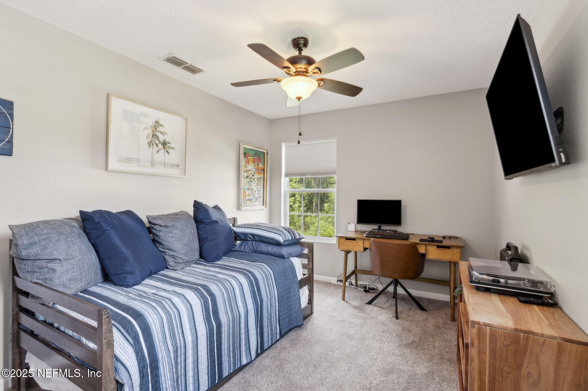 95152 Cypress Trail Fernandina Beach, FL 32034 - Photo 23 of 29 a bed room with a bed and a flat screen tv