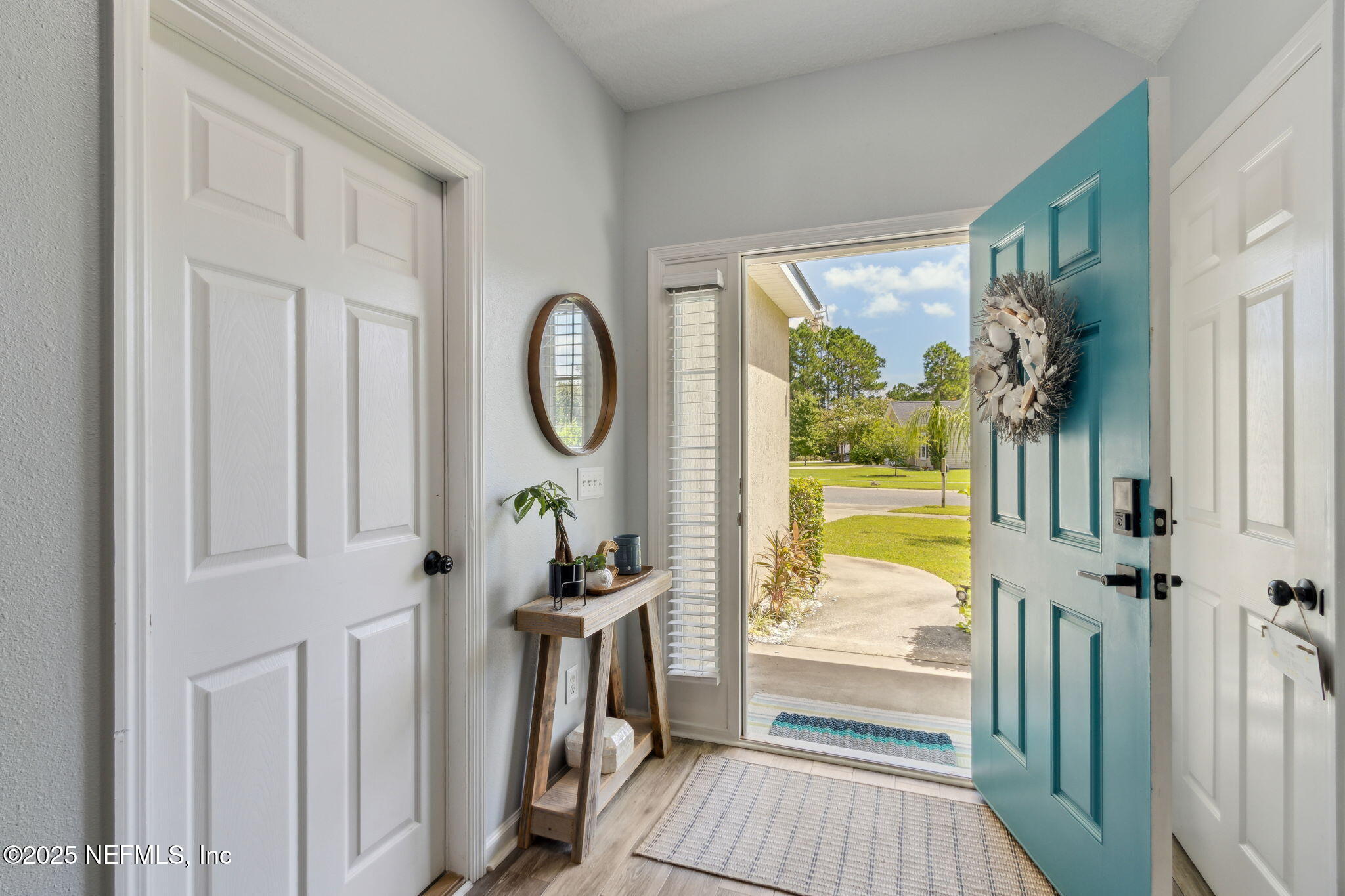95152 Cypress Trail Fernandina Beach, FL 32034 - Photo 5 of 29 a view of a porch with wooden floor door and windows