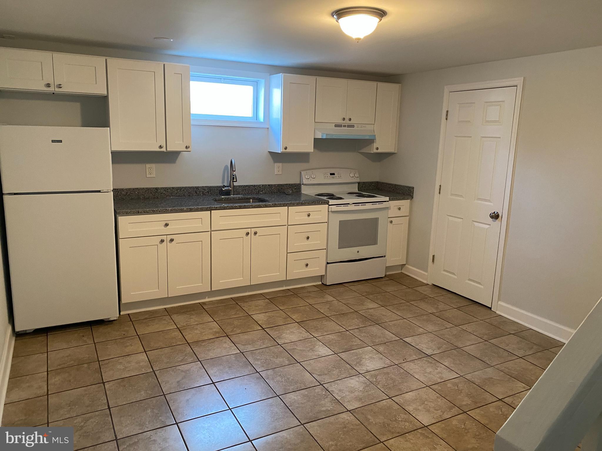 224 Wanda Road Pasadena, MD 21122 - Photo 14 of 33 New 2nd Full Kitchen in Bsmnt. w/cer, and granite