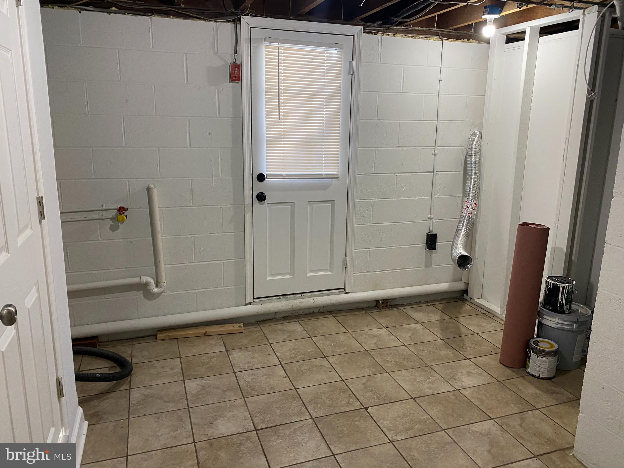 224 Wanda Road Pasadena, MD 21122 - Photo 20 of 33 Basement laundry/storage w/outside entrance
