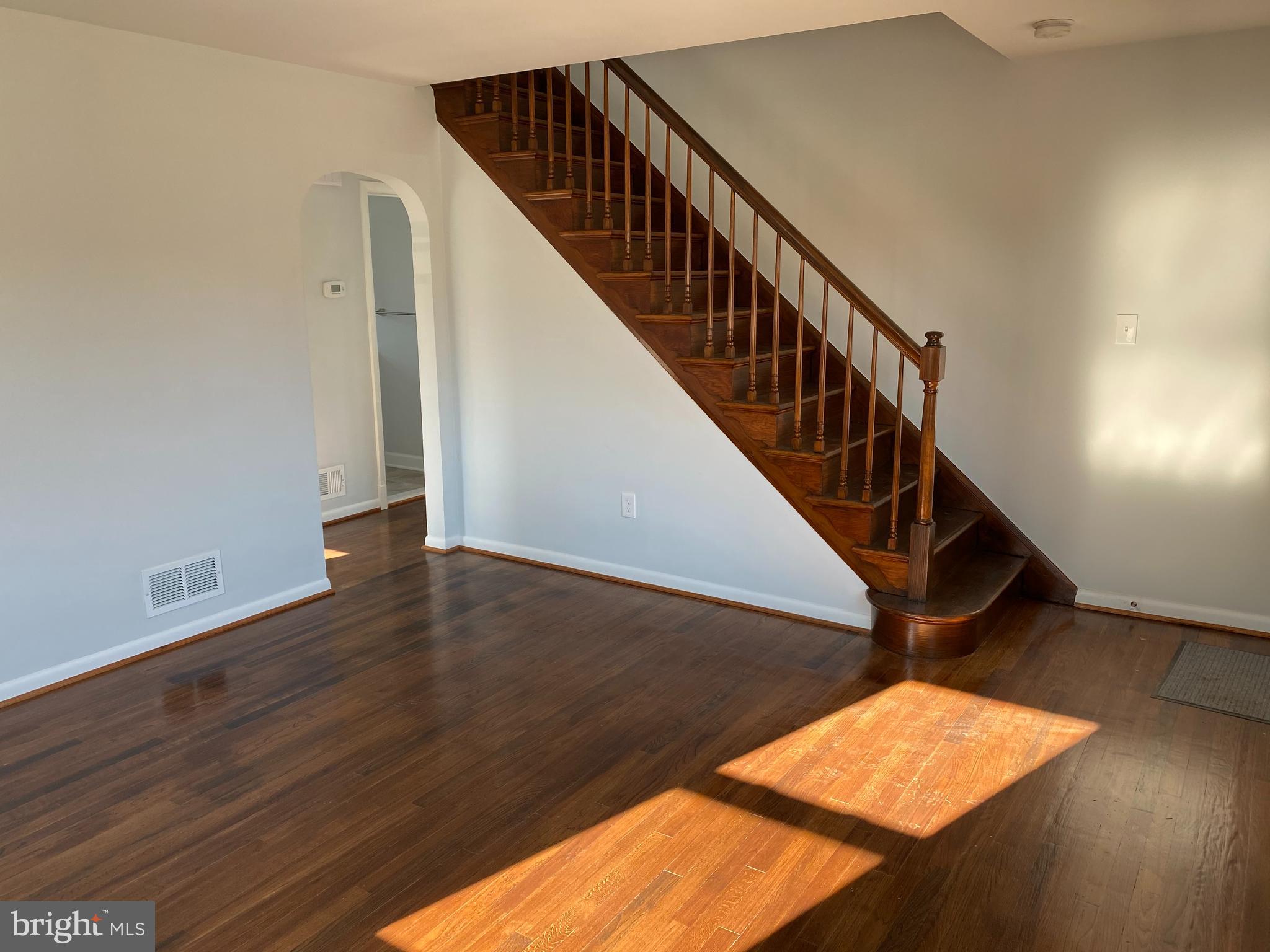 224 Wanda Road Pasadena, MD 21122 - Photo 3 of 33 Living Rm. w/ newly finished wood floors & stairs
