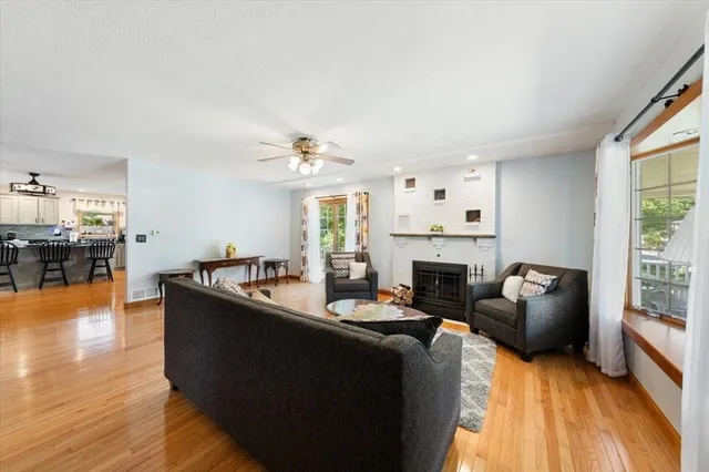a living room with furniture and a fireplace
