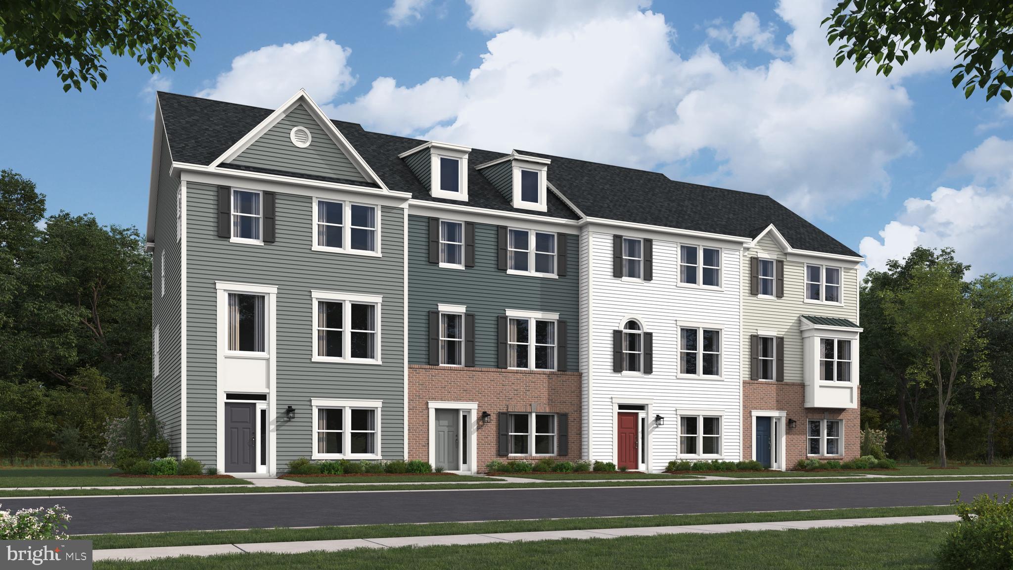 a front view of a building with lot of trees and trees