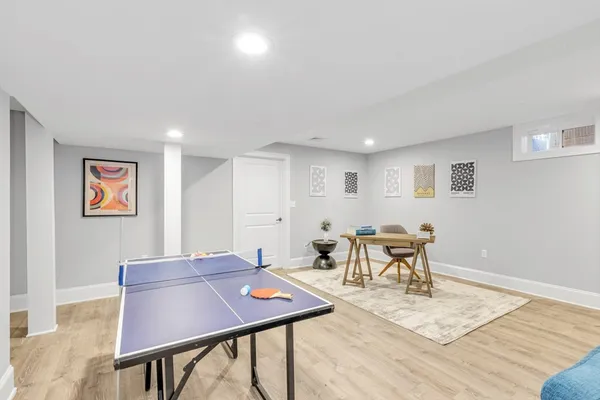 a view of a dining room with furniture and wooden floor