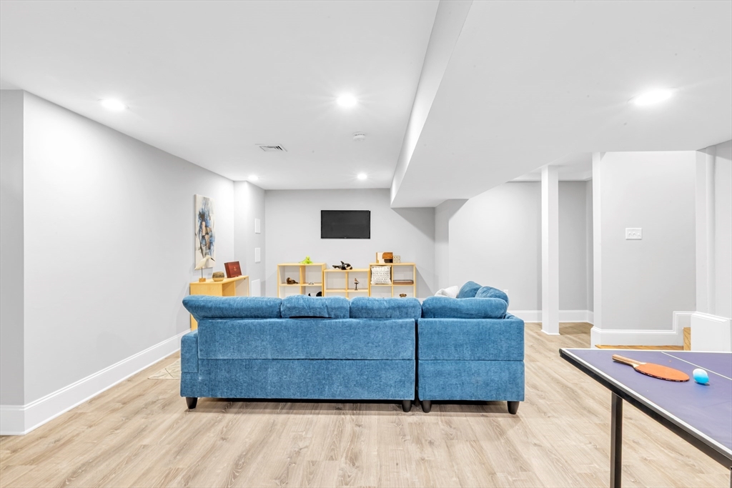 17 June Street, Unit 2 Boston, MA 02131 - Photo 13 of 31 a living room with furniture and wooden floor