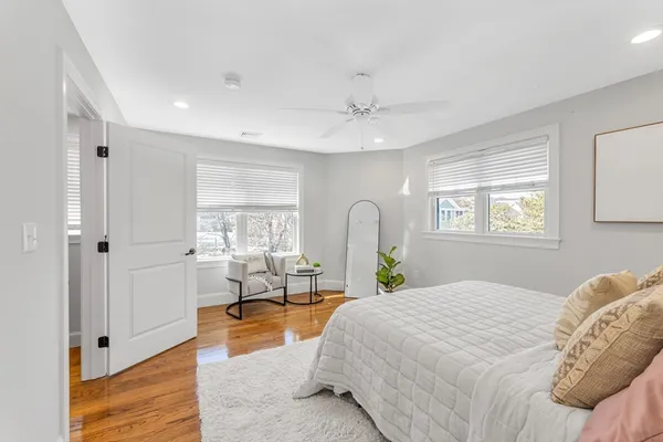a spacious bedroom with a large bed and a window