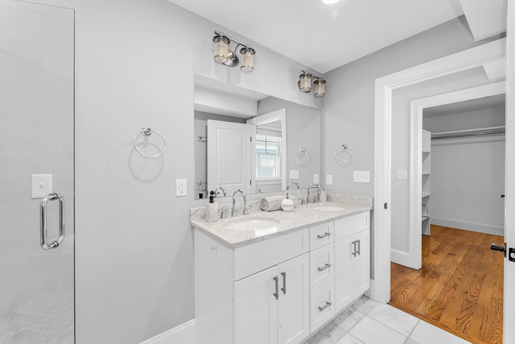 17 June Street, Unit 2 Boston, MA 02131 - Photo 20 of 31 a spacious bathroom with a double vanity sink mirror and shower