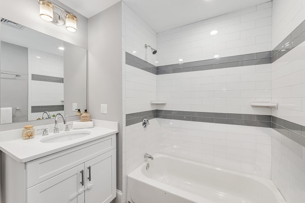 17 June Street, Unit 2 Boston, MA 02131 - Photo 22 of 31 a bathroom with a bathtub and a sink