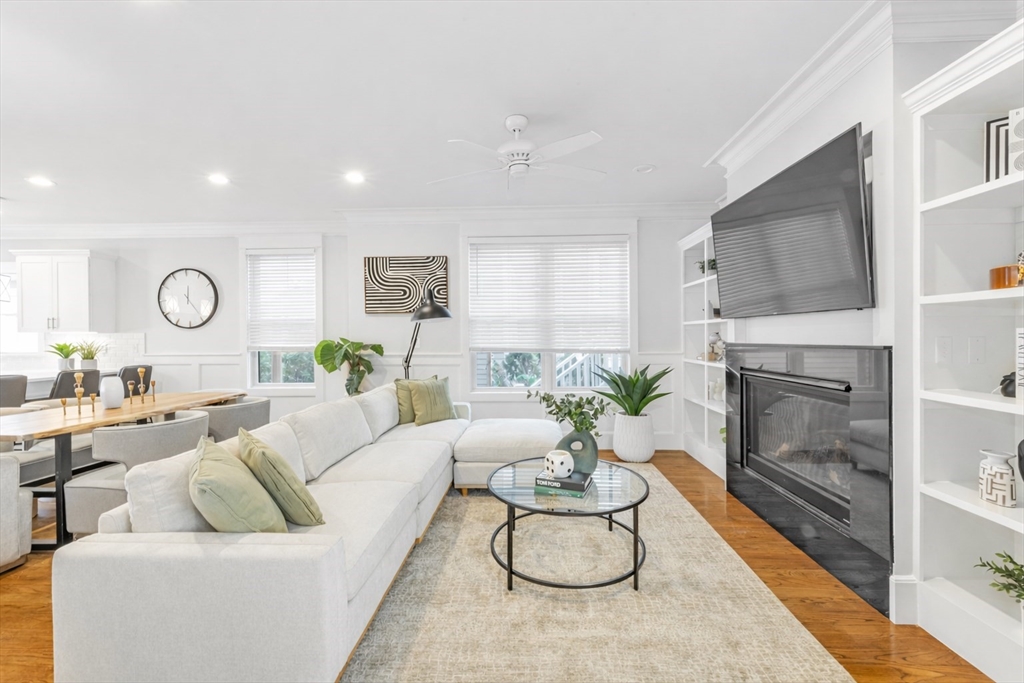 17 June Street, Unit 2 Boston, MA 02131 - Photo 3 of 31 a living room with furniture and a fireplace