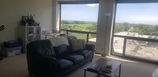 a view of a room that has a large window