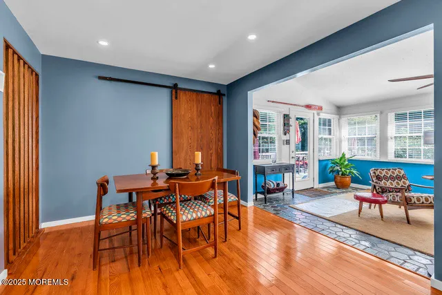 a view of a dining room with furniture and window