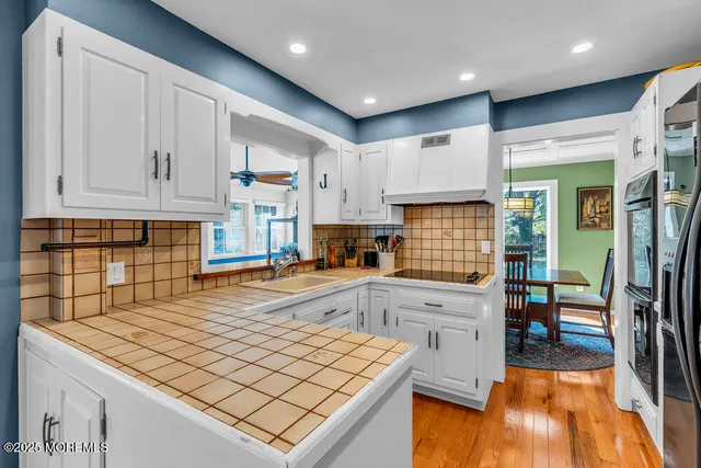 a bathroom with a toilet sink shower and mirror