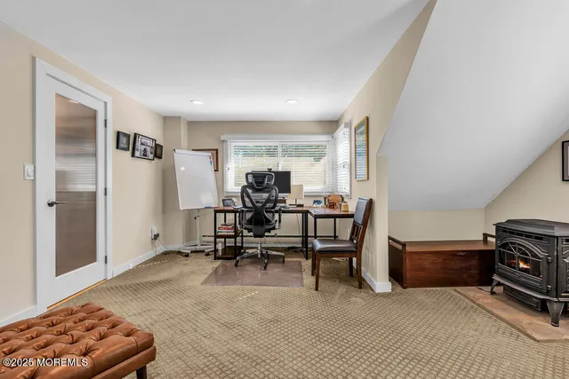 a bedroom with a large bed and a dresser