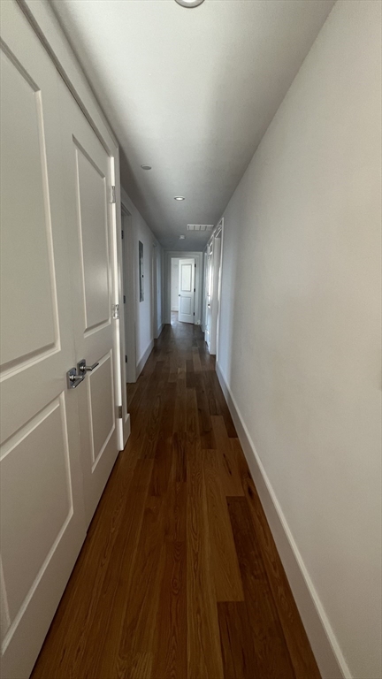 726 East 8th Street, Unit 3 Boston, MA 02127 - Photo 10 of 11 a view of a hallway with wooden floor