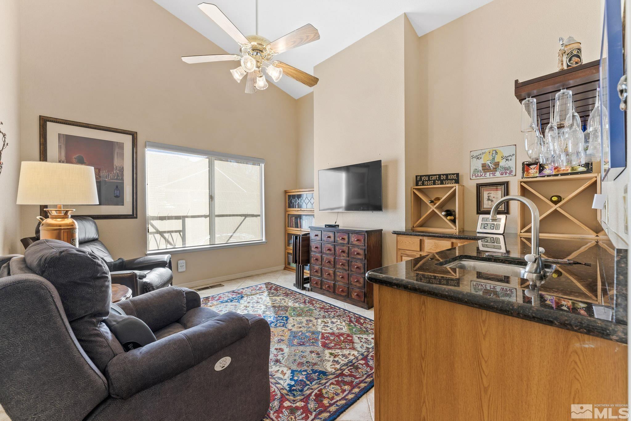 6444 Brookview Circle Reno, NV 89519 - Photo 11 of 32 a living room with furniture and a flat screen tv