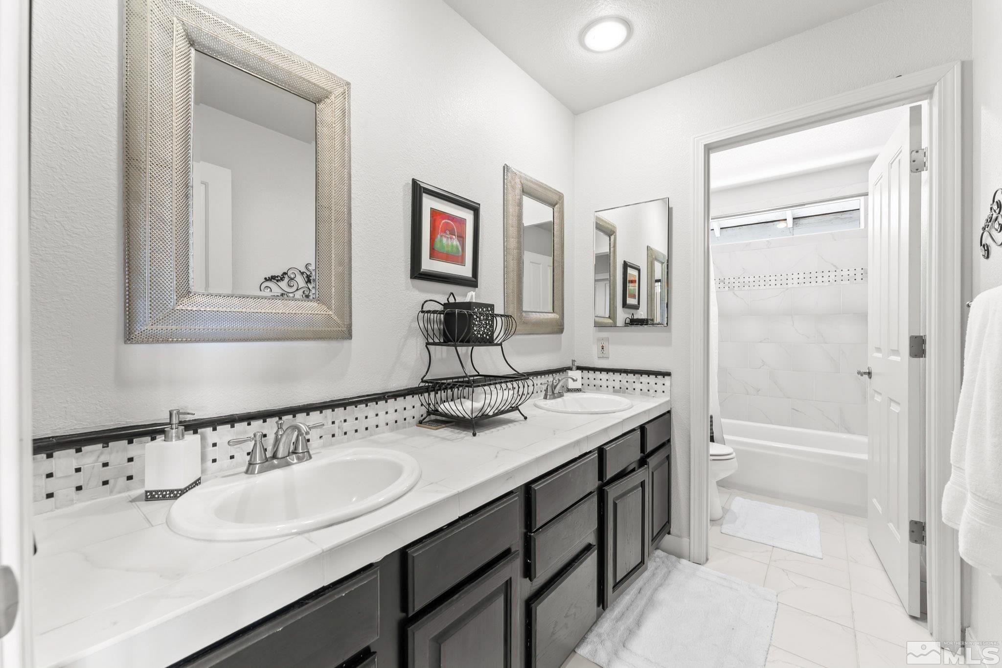 6444 Brookview Circle Reno, NV 89519 - Photo 19 of 32 a bathroom with a sink and a mirror