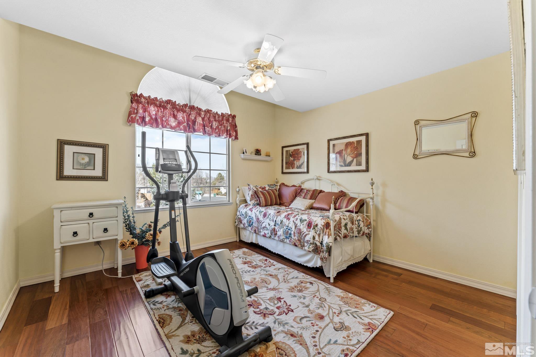 6444 Brookview Circle Reno, NV 89519 - Photo 24 of 32 a bedroom with furniture and a wooden floor