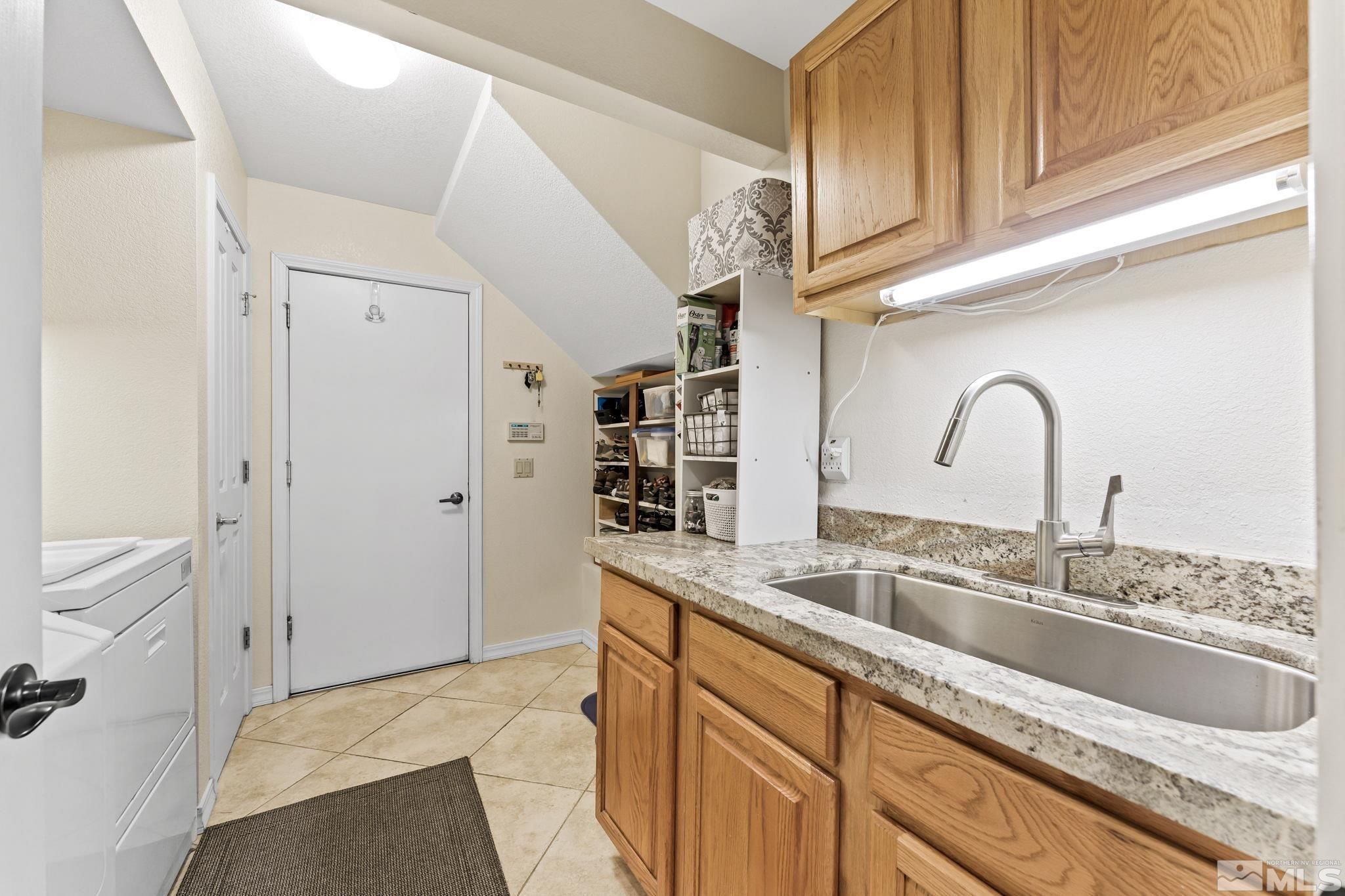 6444 Brookview Circle Reno, NV 89519 - Photo 25 of 32 a kitchen with a sink and cabinets