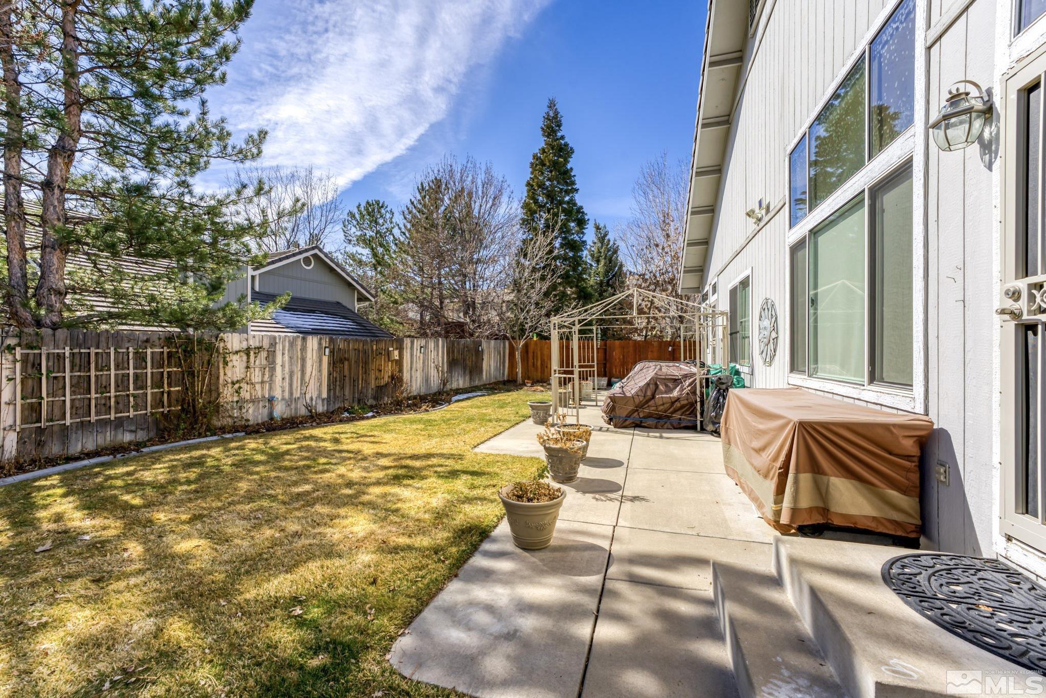 6444 Brookview Circle Reno, NV 89519 - Photo 27 of 32 a view of backyard of house with seating space
