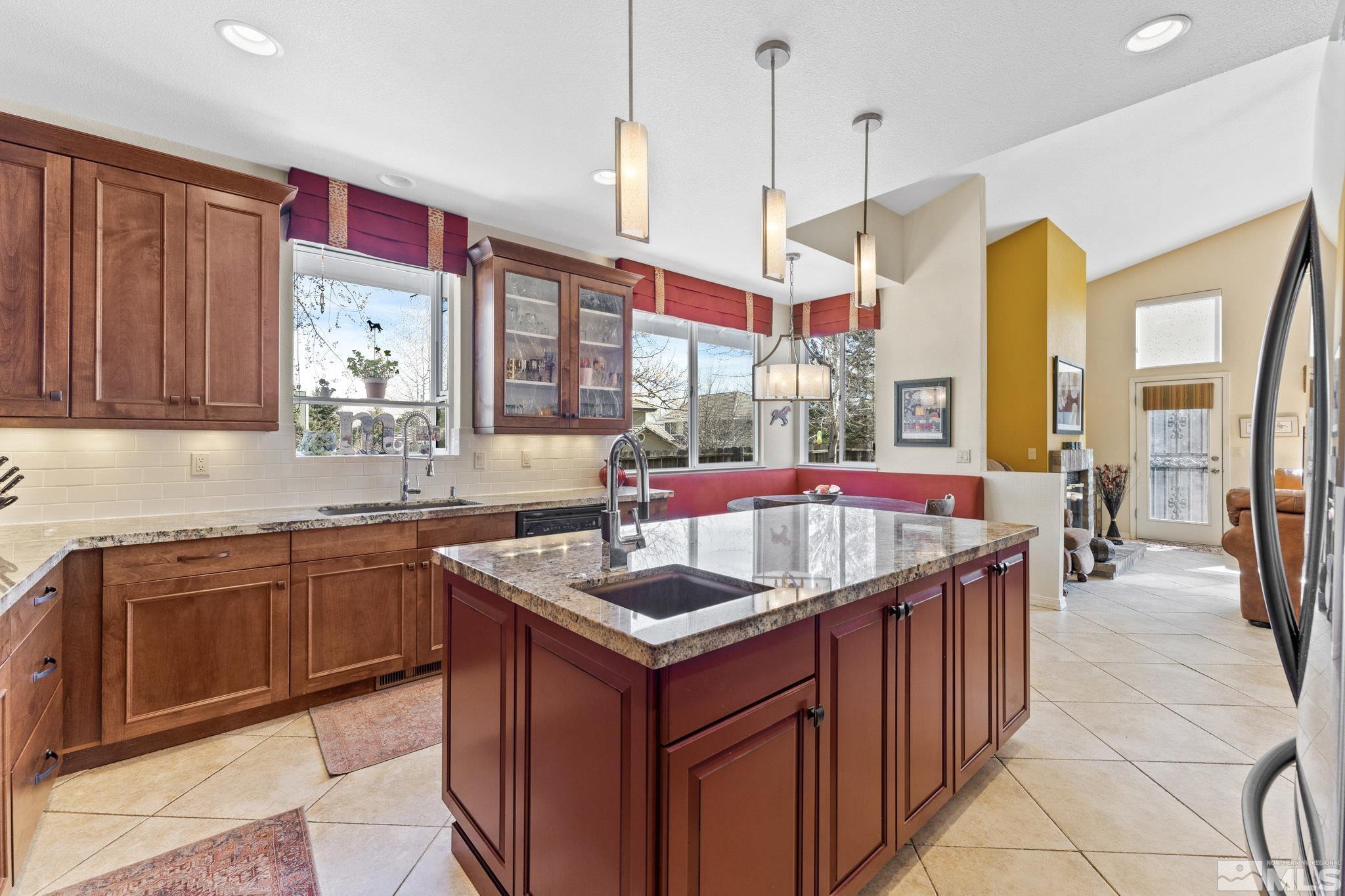 6444 Brookview Circle Reno, NV 89519 - Photo 3 of 32 a kitchen with granite countertop a sink and a stove
